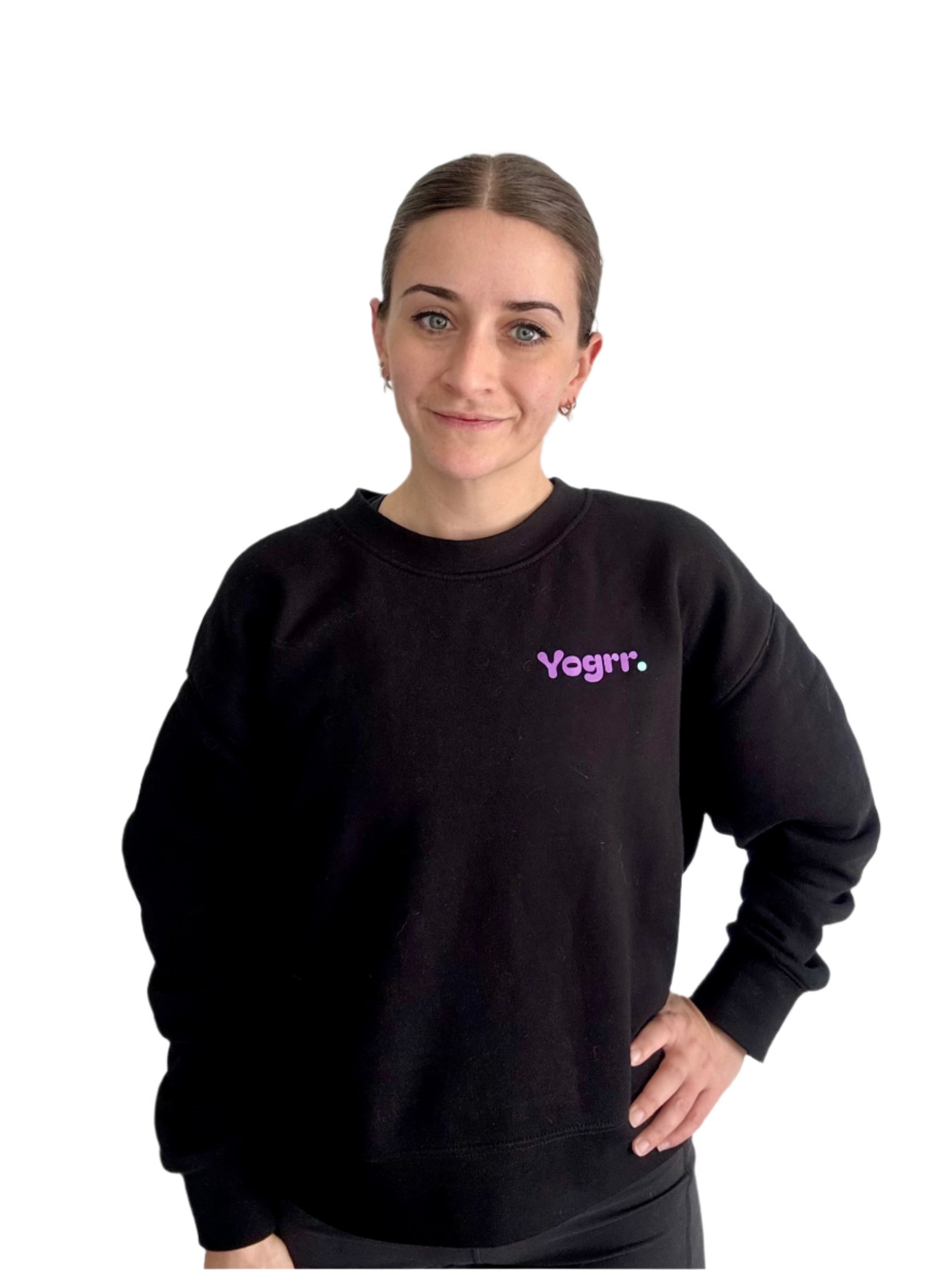 Person wearing a black sweatshirt with 'Yogrr' text on a plain background